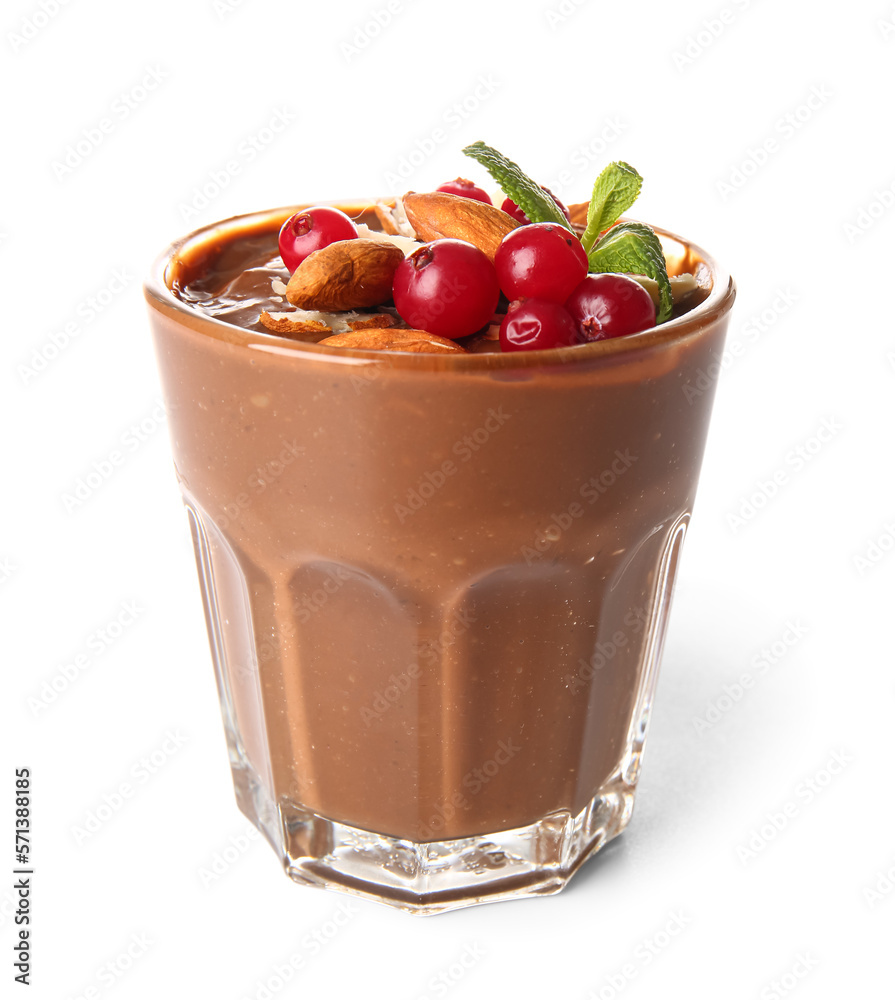 Glass of delicious chocolate pudding with cranberry, almond and mint isolated on white background