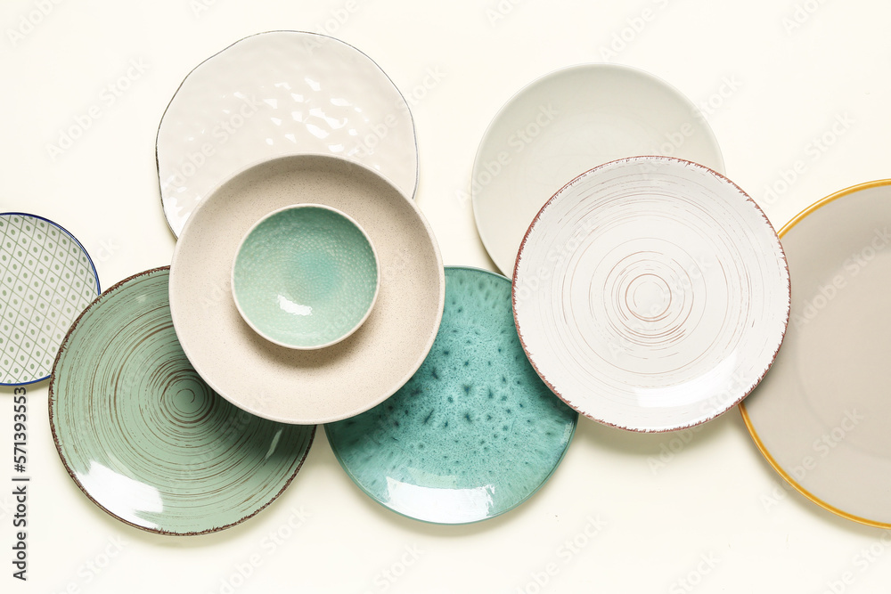 Composition with stylish ceramic plates on light background