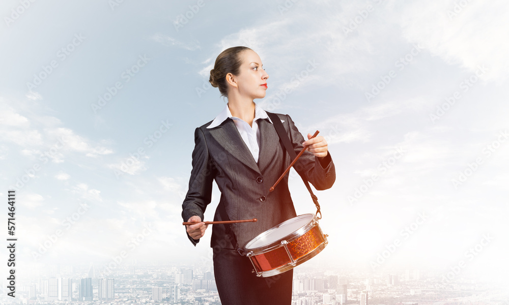 Young business woman with a drum