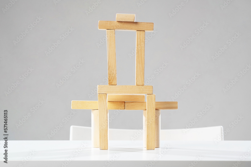 Tower from wooden blocks standing on table