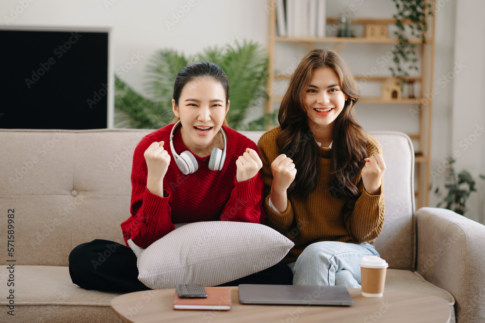 Two asian beauty smiling young women sitting on sofa Attractive casual girl feel happy and relax,hav