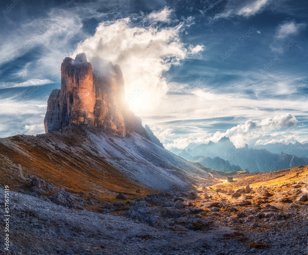 Mountain pass and blue sky with clouds at sunset in autumn. Beautiful landscape with rocks, alpine m