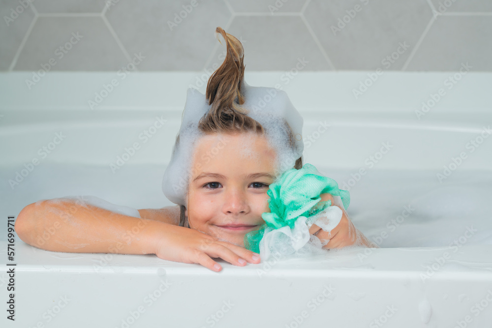 Kids shampoo. Foam on child head. Child bathes in a bath with foam.