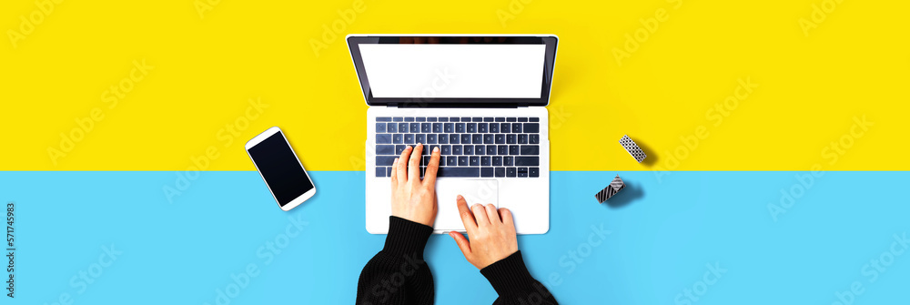 Person using a laptop computer from above