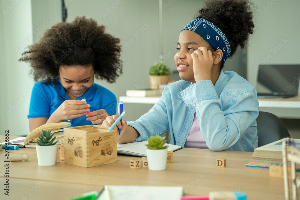 Pupils Studying At Desks In Classroom,Student doing test in primary school.