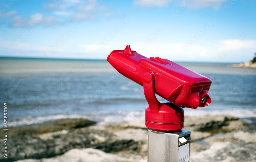 Sea coast binoculos for amazing ocean view. Sunny summer beach landscape with tourist zoom viewer