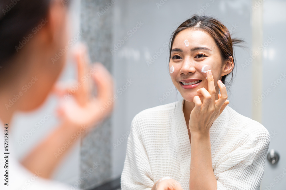 Asian beautiful woman washing her clean face with facial foam and water