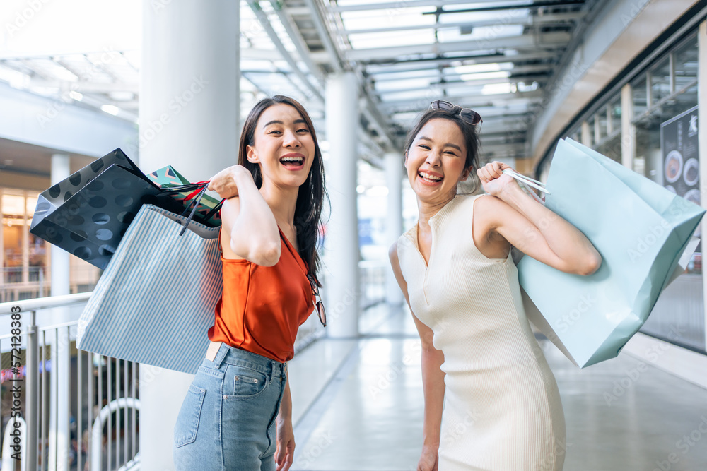 Portrait of Asian attractive two girl shopping indoor in shopping mall