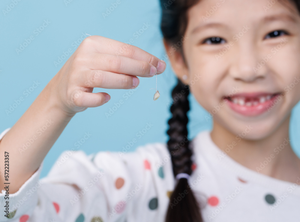 Closeup child girl smiling with loose teeth, Dentistry and Health care concept