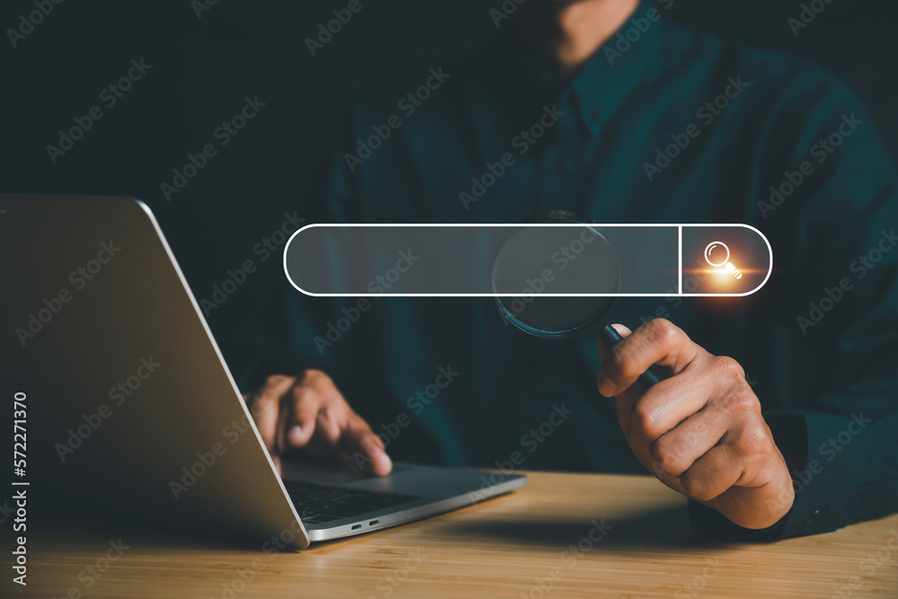 Businessman tapping search bar for SEO search concept to search information or data by internet conn