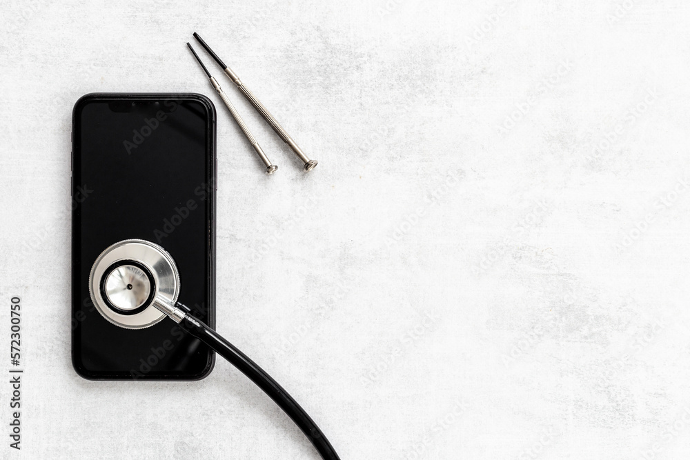 Mobile phone with stethoscope, electronics repair concept