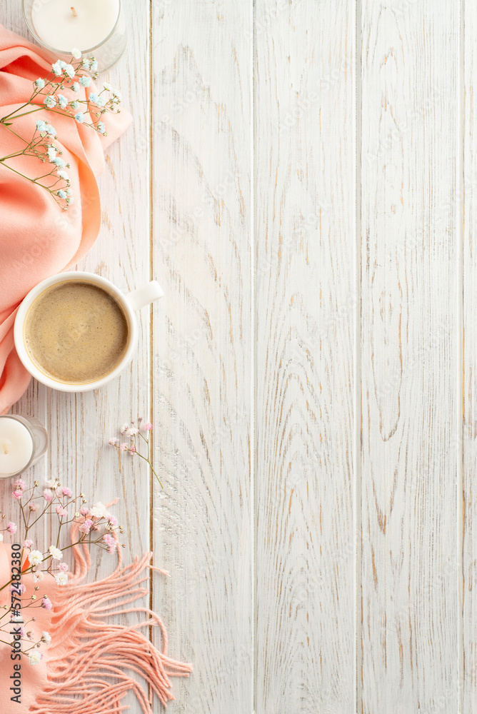 Hello spring concept. Top view vertical photo of mug of cocoa candles gypsophila flowers and pink so