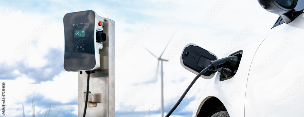 Progressive combination of wind turbine and EV car, future energy infrastructure. Electric vehicle b