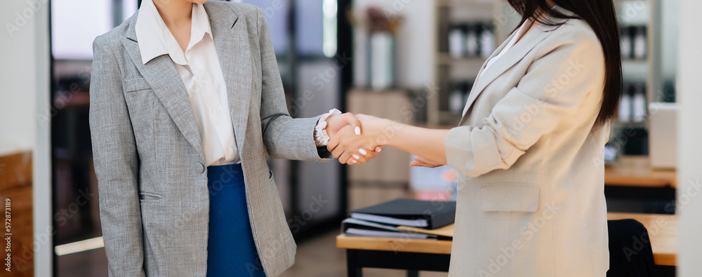 Business partnership handshake concept.Photo two coworkers handshaking process.Successful deal after