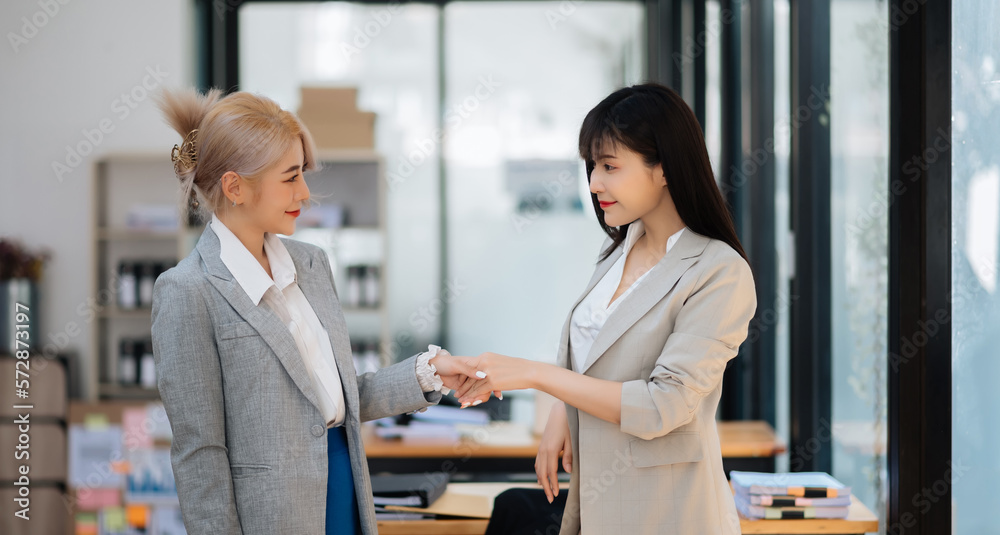 Business partnership handshake concept.Photo two coworkers handshaking process.Successful deal after