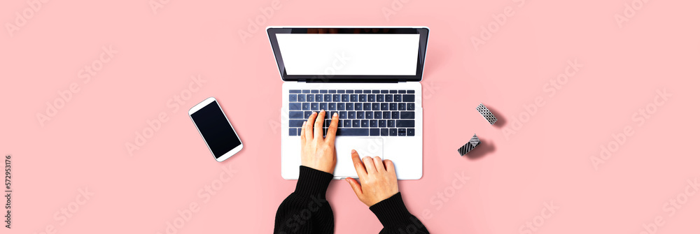 Person using a laptop computer from above