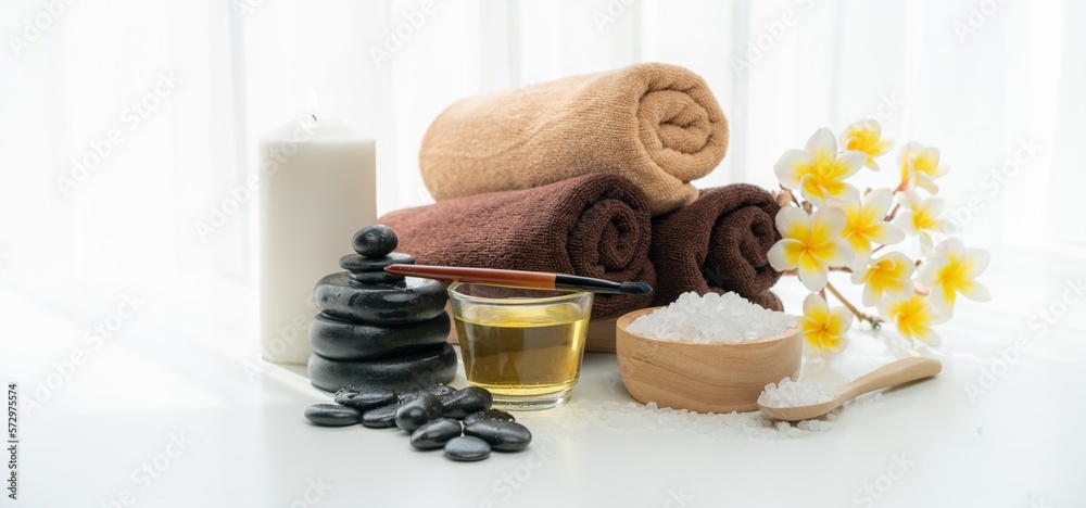 Spa accessory composition set in day spa hotel , beauty wellness center . Spa product are placed in 