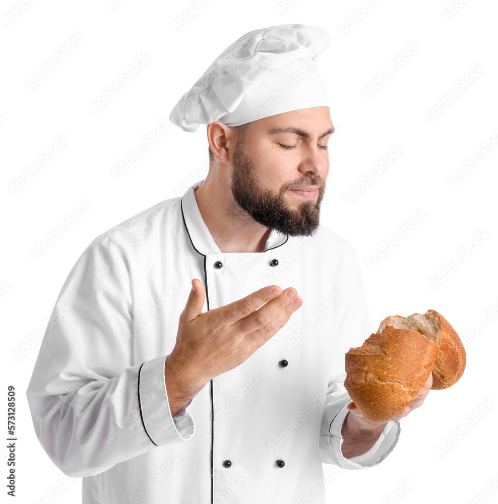 Male baker with fresh bread on white background