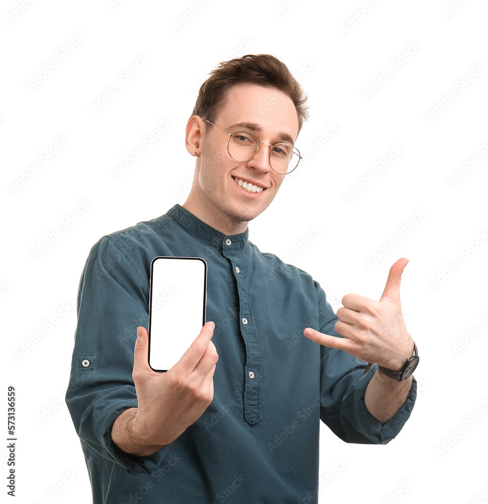 Cool young man with smartphone on white background