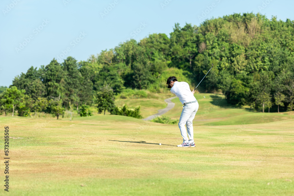 Golfer sport course golf ball fairway.  People lifestyle man playing game and swing golf tee off on 