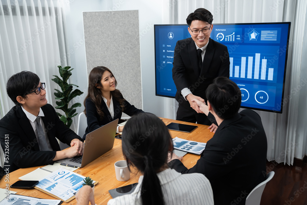 Businesspeople shake hand after successful agreement or meeting. Office worker colleague handshake w