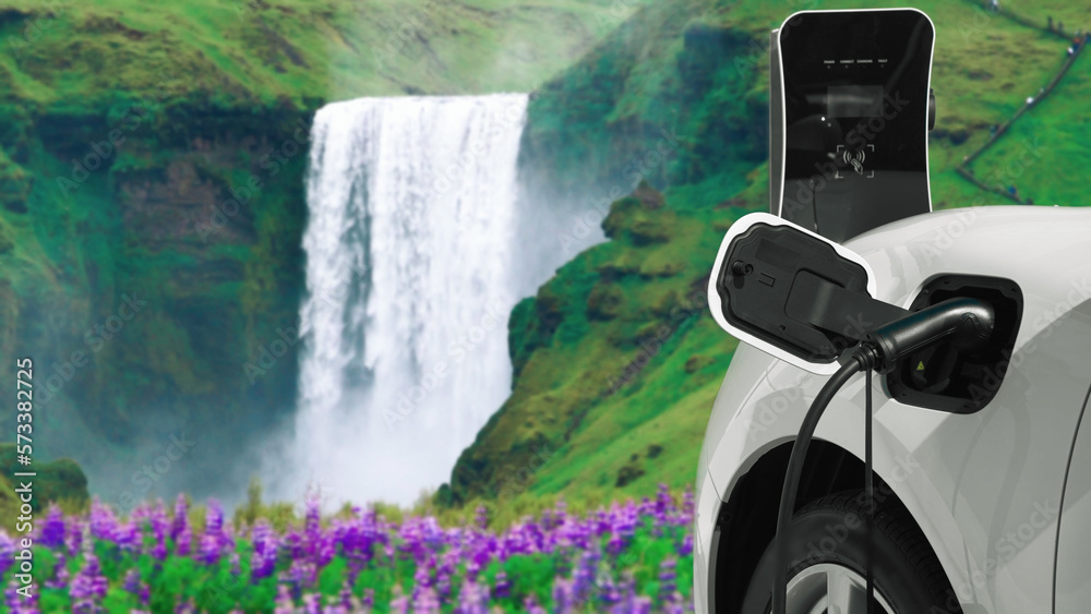 Electric car charging energy from charging station in the natural scenery, waterfall and stream back