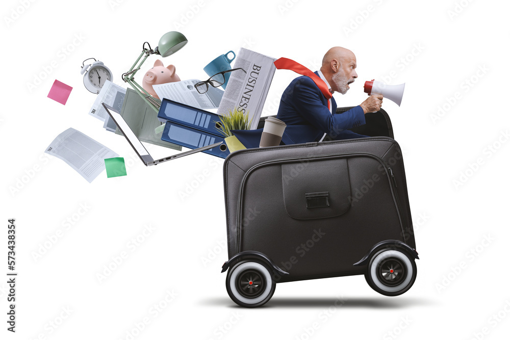 Businessman with megaphone riding a briefcase with wheels