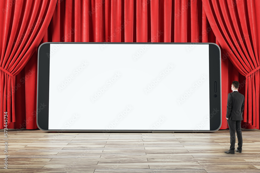 Businessman side view looking at huge smartphone blank white screen with place for your web design o