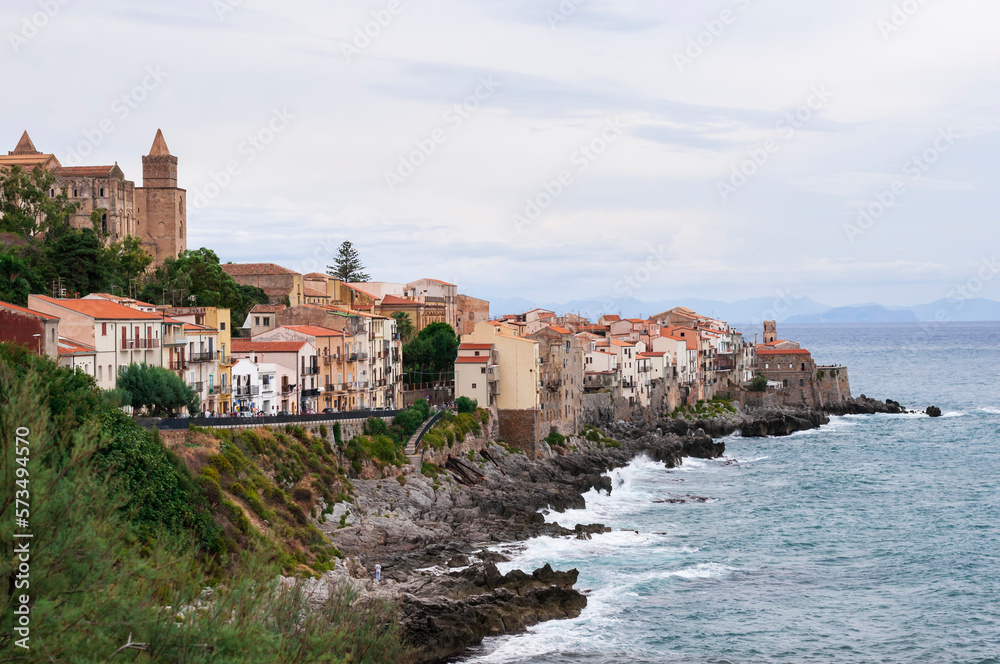 The fishing village of Cefalu in Sicily / The fishing village of Cefalu with the mighty cathedral on