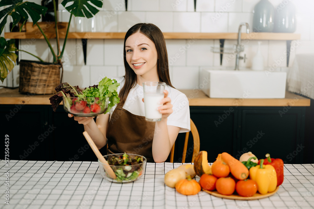 image of asian woman preparing salad in the kitchen and healthy  food in bowl at home