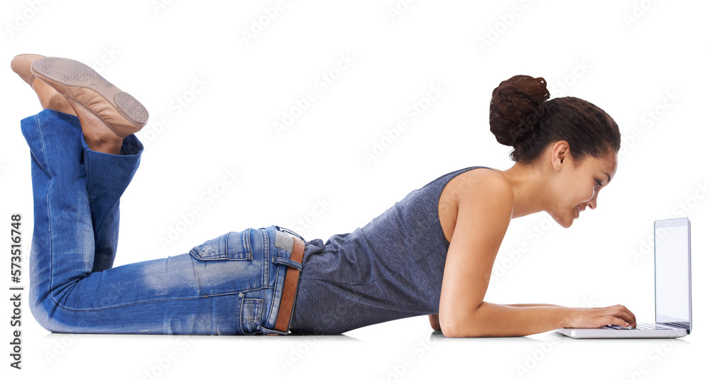 A young woman in 20s uses laptop lying on the floor with legs up, gazing enthusiastically at laptop 