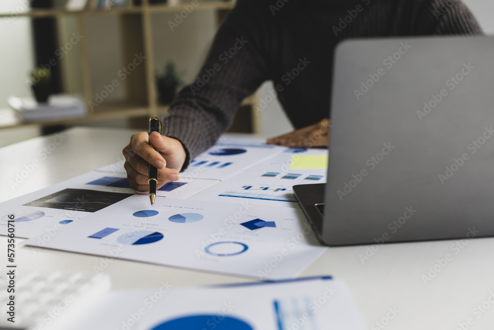 Business woman in office working on laptop reading financial account report, statistic, accounting a