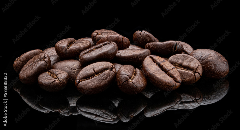 Roasted coffee beans on black background, full depth of field