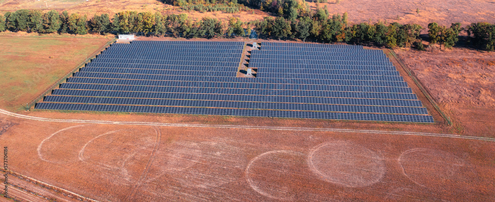 solar power station on field with sunburnt grass