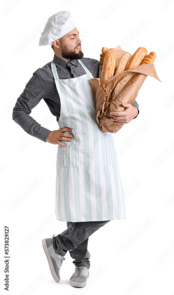 Male baker with fresh baguettes on white background