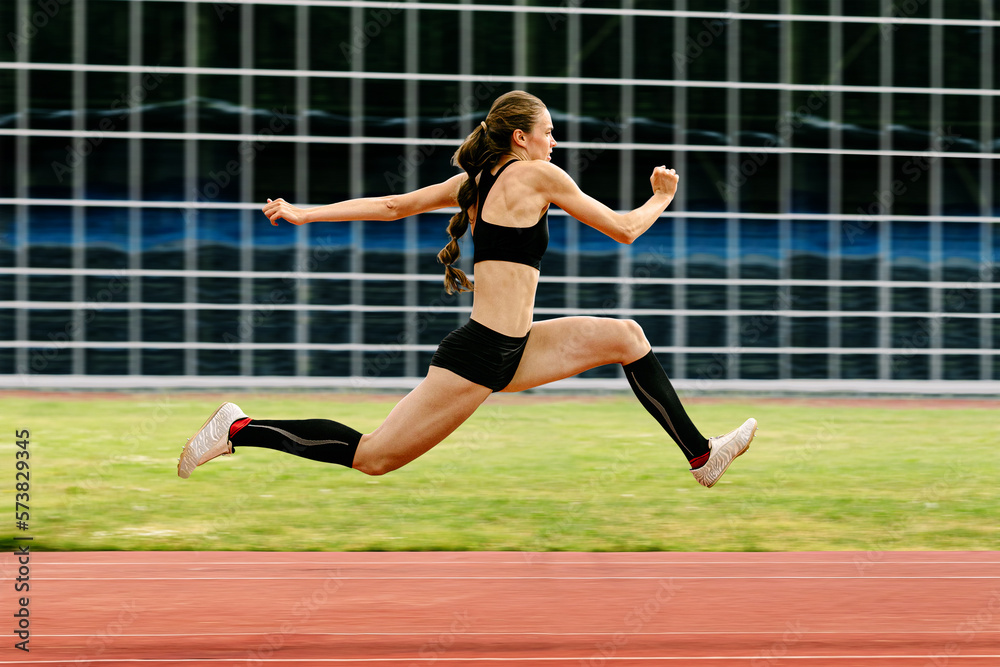 triple jump women jumper athlete on stadium