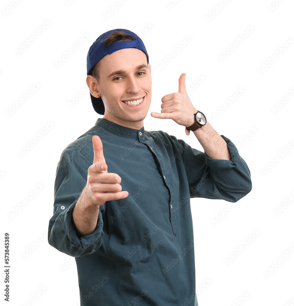 Cool young man showing  call me  gesture on white background