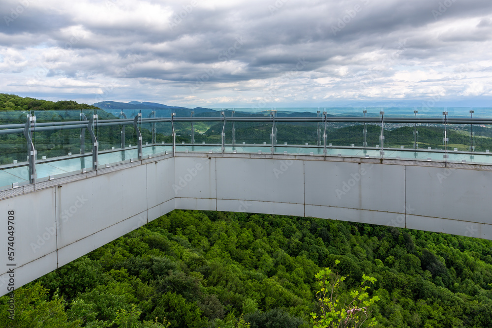 Glass walkway (observation deck) with transparent floor overlooking natural scenery of Sataplia Natu