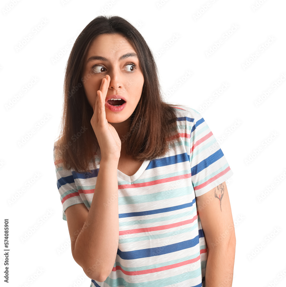 Shocked young woman in t-shirt on white background