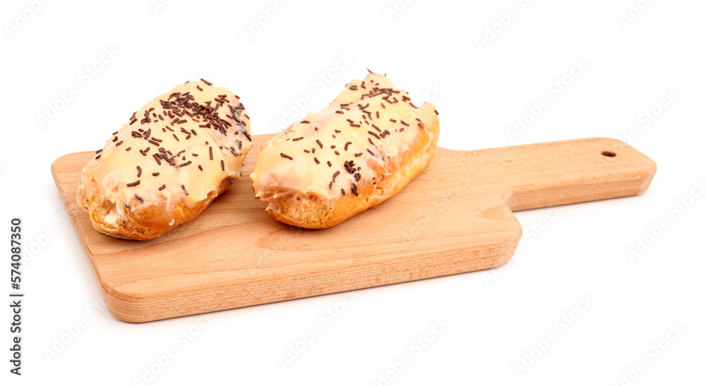 Board with sweet eclairs isolated on white background