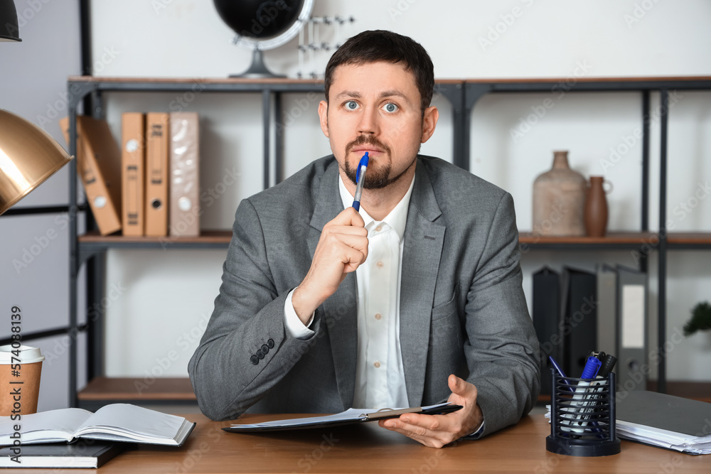 Male tutor with clipboard giving online lesson at home