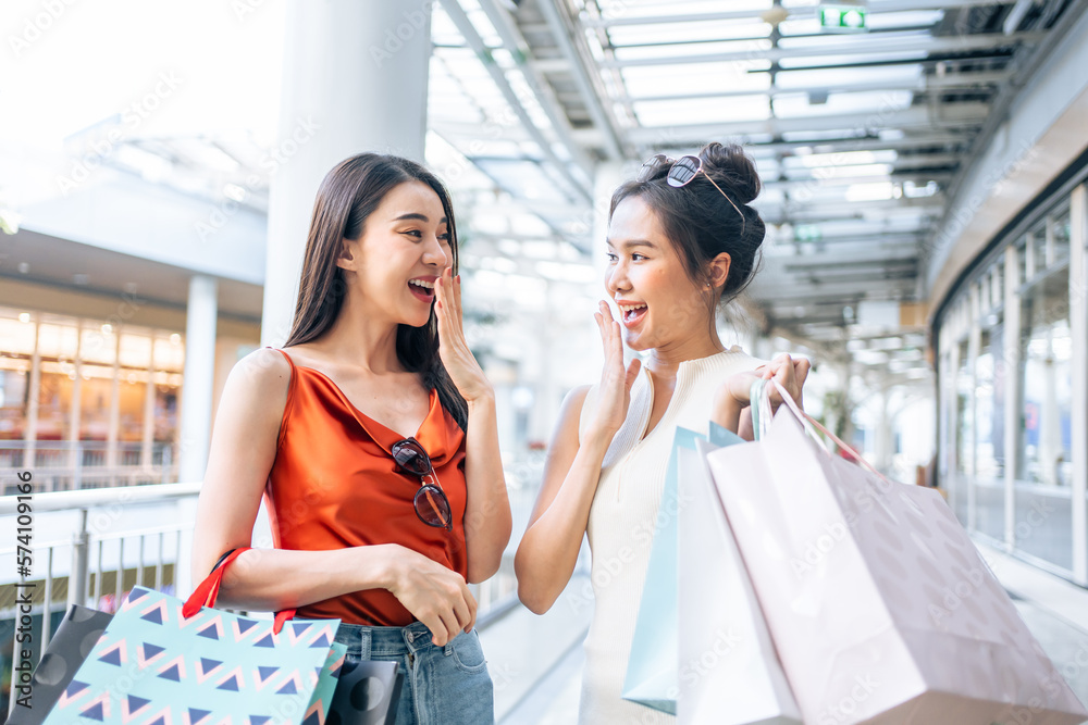 Asian young two woman shopping goods outdoors in department store.