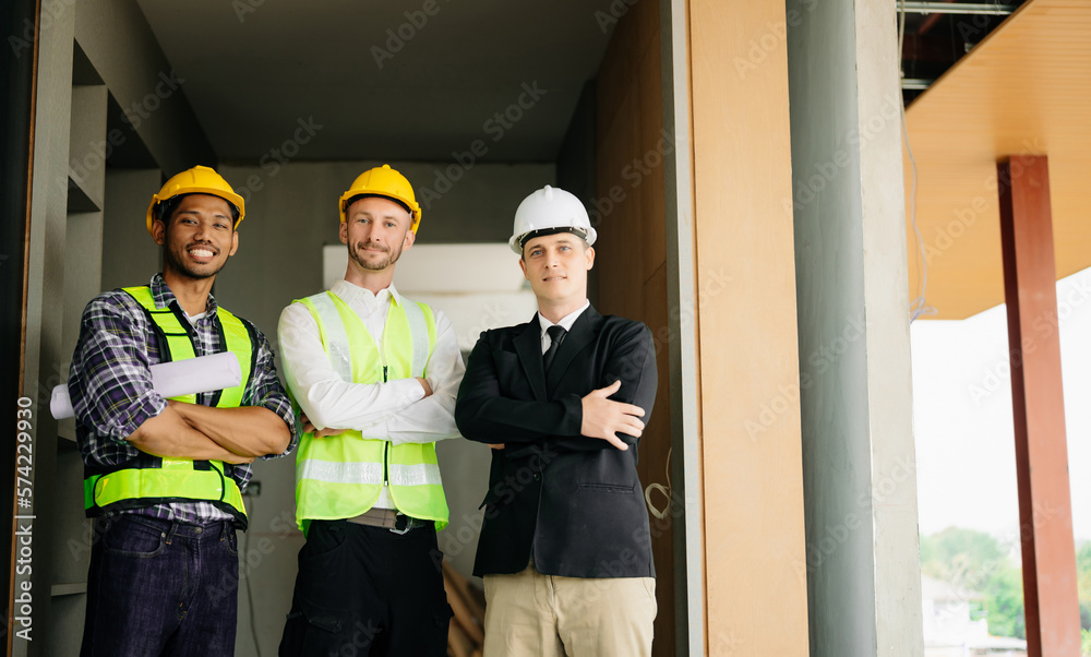 Architect caucasian man working with colleagues mixed race in the construction site. Architecture en