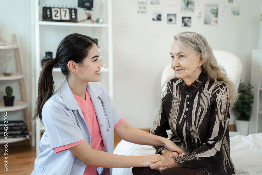 Friendly nurse supporting senior lady at nursing home,Senior services and geriatric care concept.