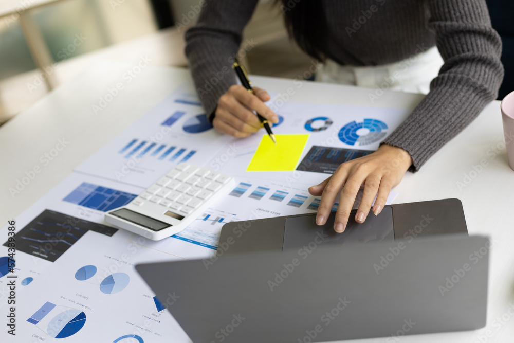 Business woman in office working on laptop reading financial account report, statistic, accounting a