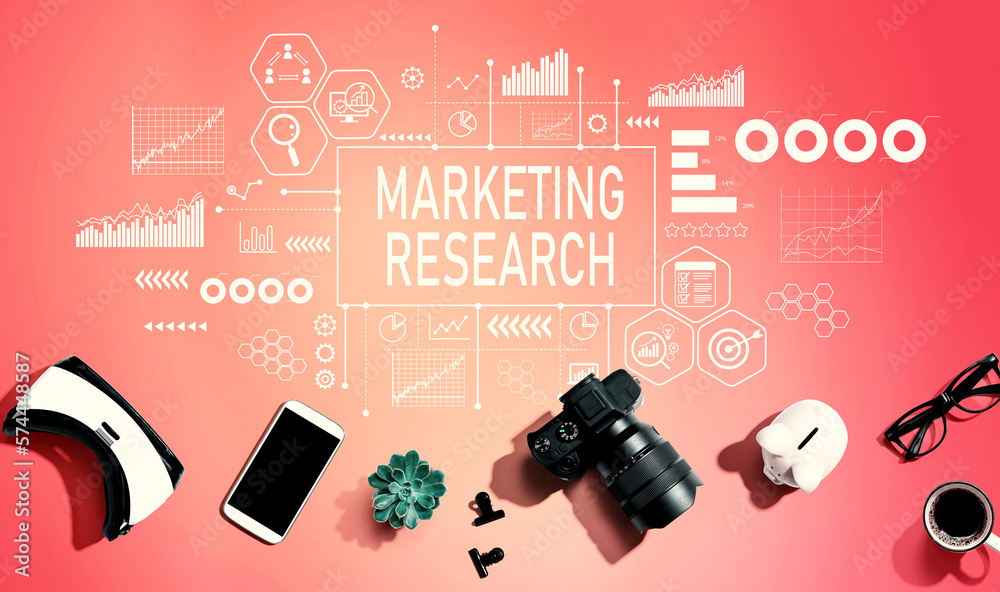 Marketing Research theme with electronic gadgets and office supplies - flat lay