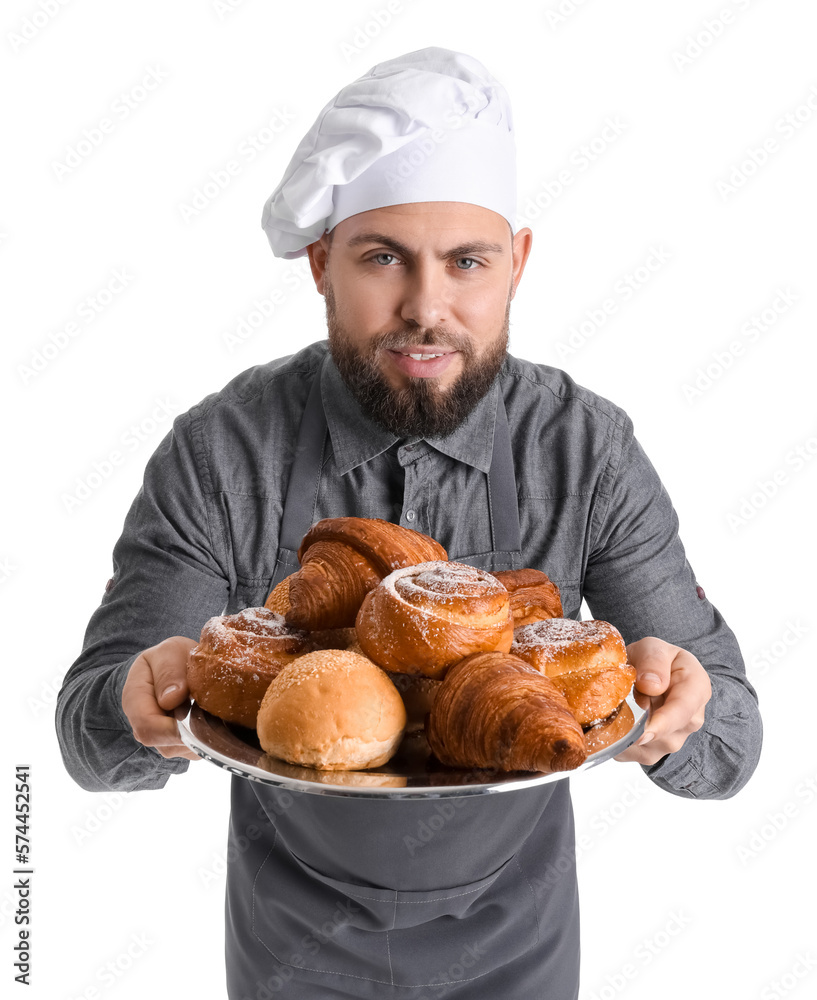 Male baker holding tray with pastries on white background