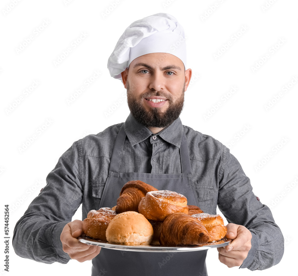 Male baker holding tray with pastries on white background