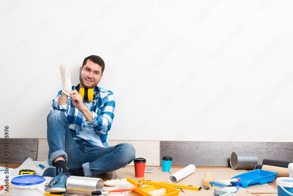 Happy guy putting on rubber gloves