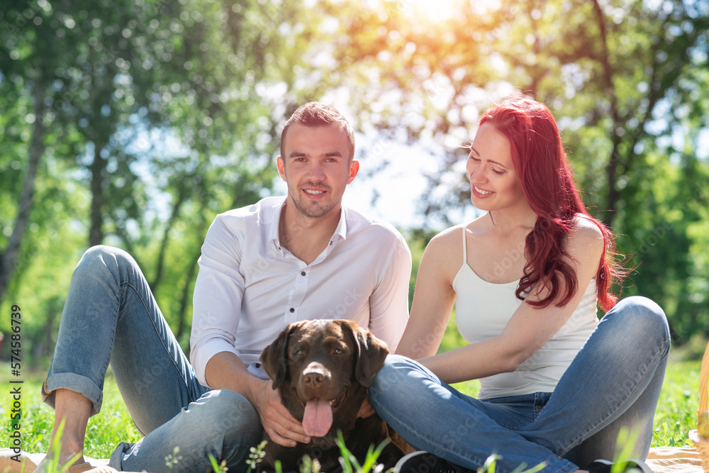 Couple with a dog in the park